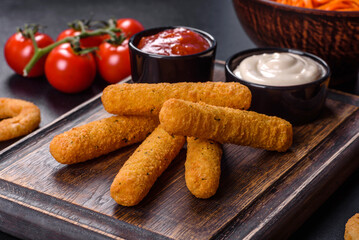 Breaded mozzarella cheese sticks served with tomato sauce