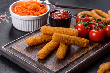 Breaded mozzarella cheese sticks served with tomato sauce