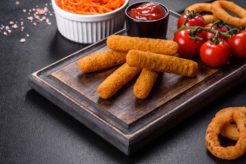 Breaded mozzarella cheese sticks served with tomato sauce