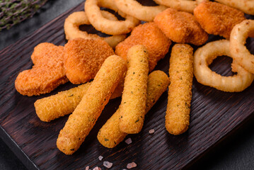 Snack platter - cheese sticks, chicken nugget, onion rings mix of snacks and sauces