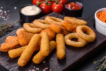 Snack platter - cheese sticks, chicken nugget, onion rings mix of snacks and sauces