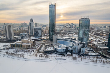 Obraz premium Yekaterinburg aerial panoramic view in Winter at sunset. Yekaterinburg city and pond in winter.
