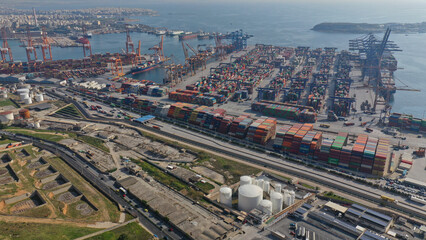 Obraz premium Aerial drone photo of industrial logistics unloading import and export container terminal of Perama - Piraeus, Attica, Grreece