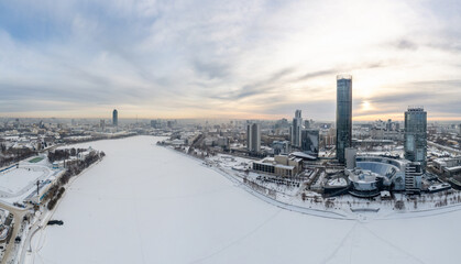 Yekaterinburg aerial panoramic view in Winter at sunset. Yekaterinburg city and pond in winter.