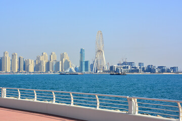 Dubai, UAE - View at skyscrapers and Dubai Eye from man-made, artificial Palm Jumeirah Island