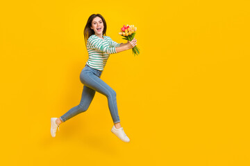 Full body photo of running attractive girl give mom present on birthday woman day isolated on yellow color background