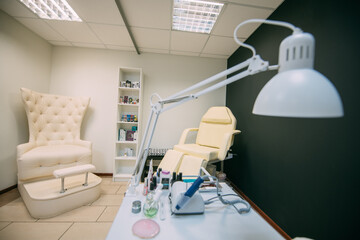 The interior of the nail salon without people. A bright, modern salon for the care of nails