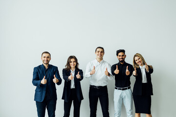 Business leaders with employees group showing thumbs up looking at camera, happy professional...