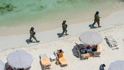 Marina soldiers of Mexican army patrolling beach in Cancun