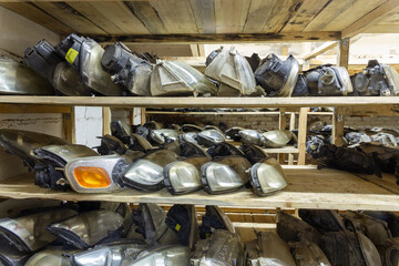 Used headlamp components for sale on the store shelf.