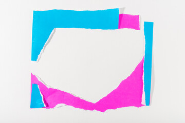 Neon blue and purple torn paper strip frame on white background.