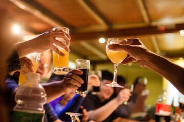  People making cheers with sugar drinks.