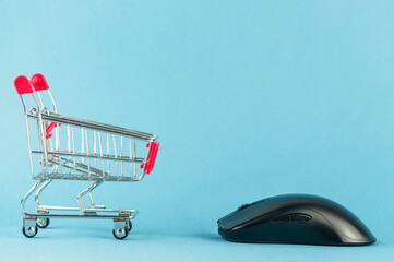 shopping cart and computer mouse, online shopping concept.