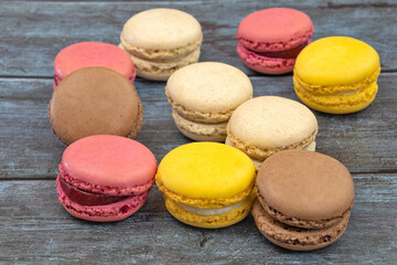 several macarons on a gray background