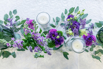 Obraz na płótnie Canvas Purple and violet wedding flower arrangements, made out of carnations lisianthus and matthiola flowers. 