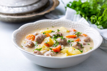 Seasoned soup with meatballs with vegetables. English name; sulu kofte, eksili kofte, terbiyeli kofte)