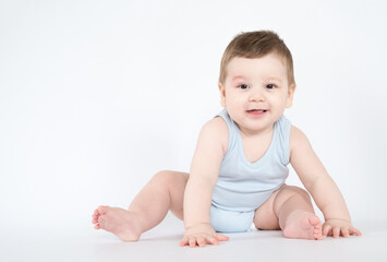 child baby boy sitting happy smiling boy on a white 7 month background