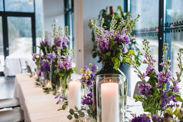 Purple and violet wedding flower arrangements, made out of carnations lisianthus and matthiola flowers. 