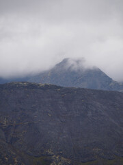 The clouds caught on the tops of the mountains. Low clouds in the mountains. Khibiny, Russia.