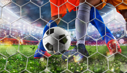 Soccer player kicks the ball to reach the goal