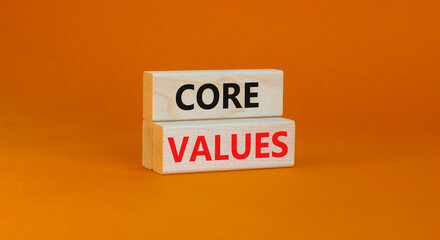 Core values symbol. Concept words Core values on wooden blocks on a beautiful orange table orange background. Business value and core values concept, copy space.