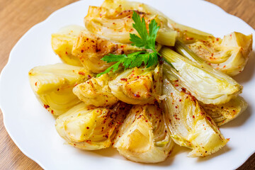 Organic Baked Fennel Bulbs with Salt and Pepper. Fennel dish with olive oil.