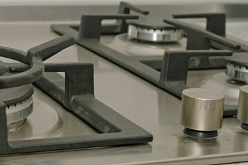 Gas stove with steel hob close-up