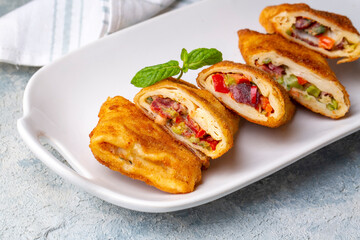 Turkish Pacanga Boregi with pastirma (pastrami) and cheddar (melted) cheese. - Pastirmali Borek