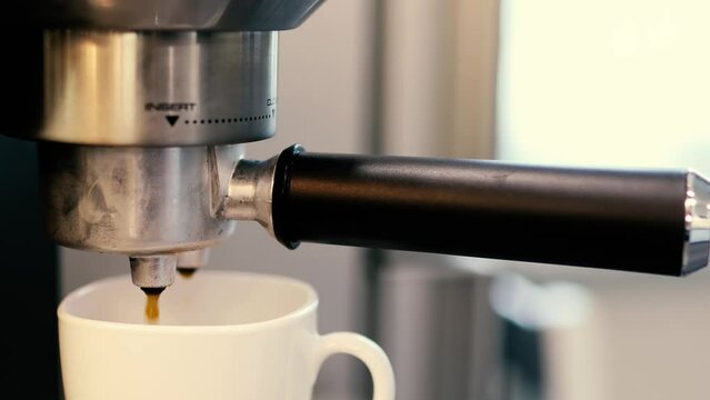 preparation of espresso coffee in a carob coffee maker, fresh coffee in a coffee machine.