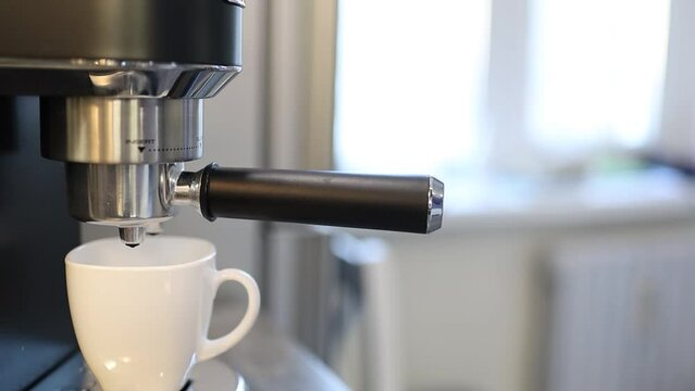 preparation of espresso coffee in a carob coffee maker, fresh coffee in a coffee machine.