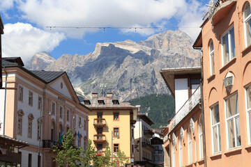 Fototapeta na wymiar Cima Tofana mountain panorama view with houses in Cortina d'Ampezzo, Italy