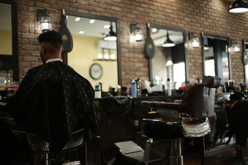 barber giving a haircut in barbershop