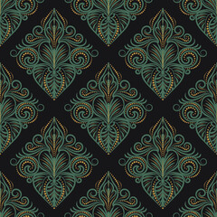 Damask seamless pattern. Lace fabric in vector, green and yellow ornament. Textile wallpaper on a black background 