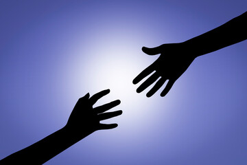 Silhouette of helping hand in blue sky.