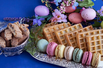 macarons and various sweet treats photographed with Easter decor