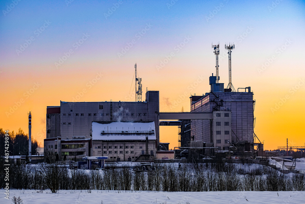 Canvas Prints winter russian landscape with the image of a factory at sunset