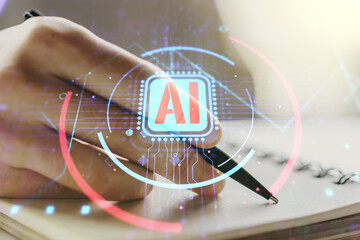 Double exposure of creative artificial Intelligence abbreviation with man hand writing in notepad...