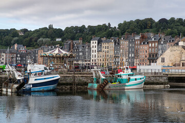 Fototapeta na wymiar City of Honfleur in Normandy with its typical houses and boat lock in the quay