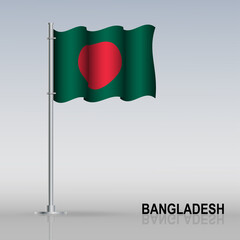 Flag of Bangladesh flying on a flagpole stands on the table