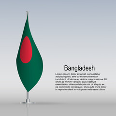 Flag of Bangladesh hanging on a flagpole stands on the table