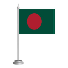 Flag of Bangladesh flying on a flagpole stands on the table