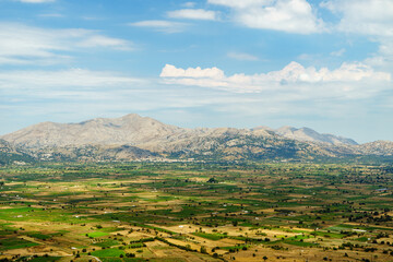 View of the Lasithi plateau with mountains in the background in Crete, Greece