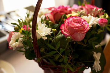 woman Hands making modern bouquet of different flowers