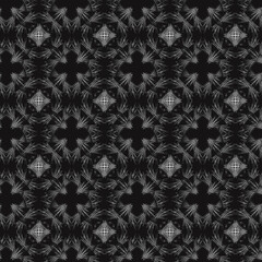 Seamless geometric pattern of mandalas, flowers. A white ornament on a black background, hand-drawn. Retro style. Design of the background, interior, wallpaper, textiles, fabric, packaging.