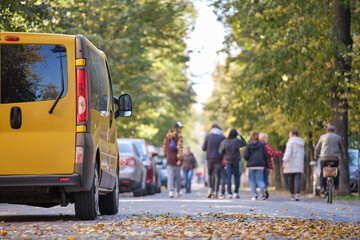 Close up of a car parked illegally against traffic rules on pedestrian city street side