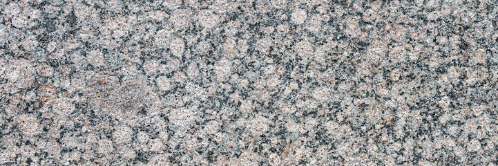 Granite texture. Natural gray granite with a grainy pattern. Stone background. Solid rough surface of rock. Durable construction and decoration material. Close-up. - obrazy, fototapety, plakaty