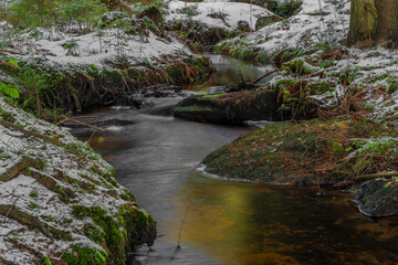 Creeks near Javorice hill in winter snowy forest