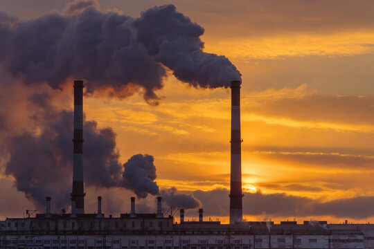 Industrial factory pollution, smokestack exhaust gases. Industry zone, thick smoke. Climate change and global warming