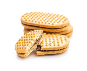 Sweet sandvich cookies. Biscuits with cocoa cream filling isolated on white background.