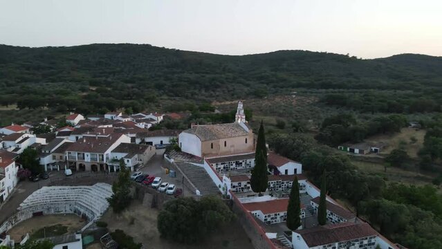Dron shot Espania Spain Tenerife open shot sun afternoon sky buildings smog water lake paning left moutan alone covid trees tree front green bus back cars rush hour road covid empty sun sunset.mp4